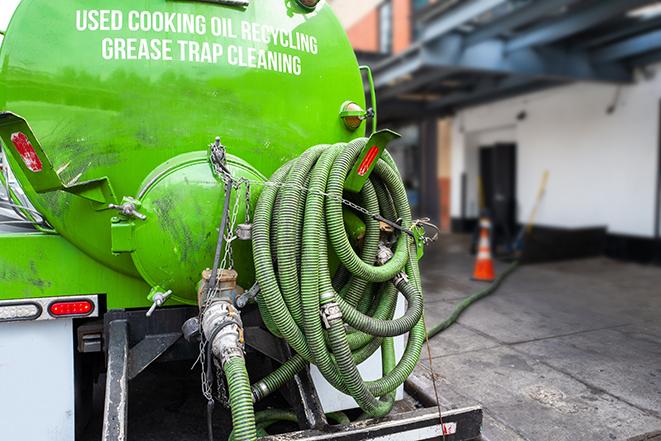 heavy-duty vacuum truck pumping out a grease trap in Gurnee, IL